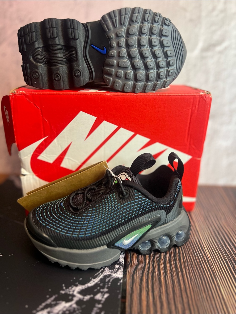 Nike Kids Black Sneakers with Teal Stitching and Green Accent